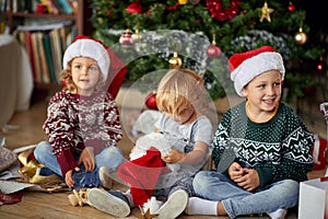 Child boy in Santa hat at Christmas.Happy  childhood on  Christmas