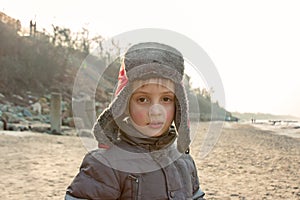 Child boy at sea shore