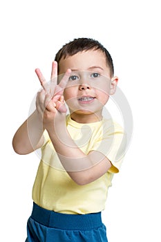 Child boy show the number three with hands