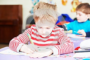 Child boy studying writing