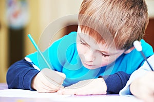 Child boy studying writing