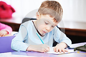 Child boy studying writing photo