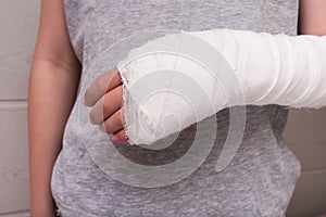 A child broken arm in plaster case, hand injury because of accident, forearm bones fracture