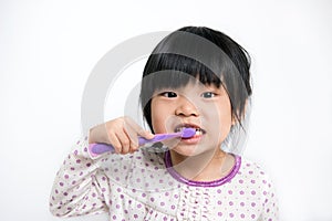 Child brushing teeth