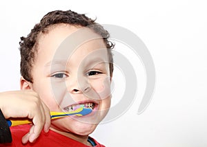 Child brushing teeth with an electric tooth brush stock photo