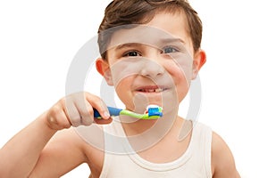 Child brushing teeth isolated