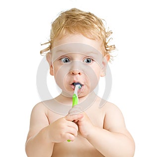 Child brushing teeth isolated on white