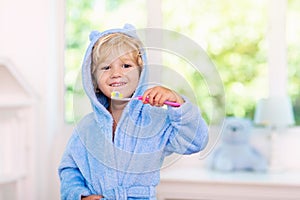 Child brushing teeth. Kids tooth brush photo