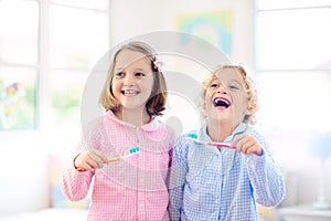 Child brushing teeth. Kids with toothpaste, brush
