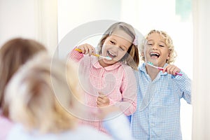 Child brushing teeth. Kids with toothpaste, brush