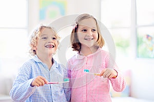 Child brushing teeth. Kids with toothpaste, brush