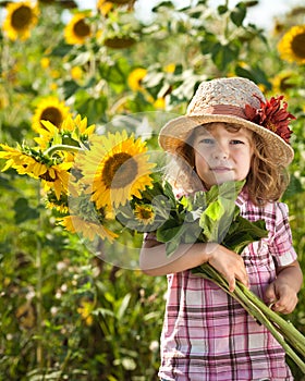 Child with bunch of sunflowers