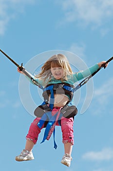 Child on bungee trampoline