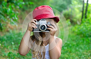 Child with camera. Little girl photographing. beautiful little g