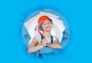 Child care development. Kid engineer with carpenter work hammer. Labor day at 1 may. little girl in hard hat holds