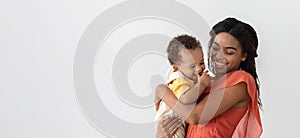 Child Care. Portrait Of Smiling Black Mother With Toddler Baby In Arms