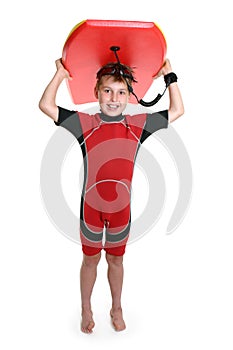 Child carrying a surfboard