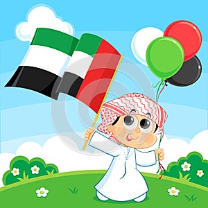 Child carrying United Arab Emirates flag