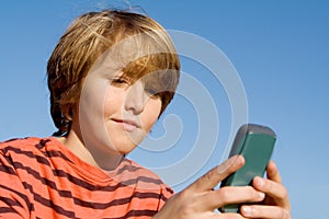 Child with cell or mobile phone