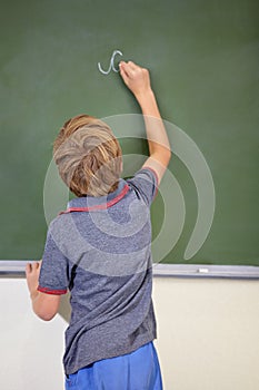 Child, chalkboard and school writing with education, cursive and answer for learning. Back, knowledge and kid