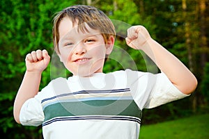 Child cheering outdoors