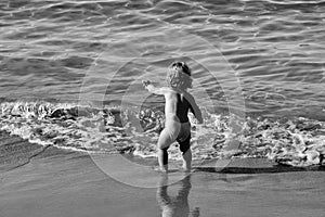 Child Childhood Children Happiness Concept. Small boy in sea water
