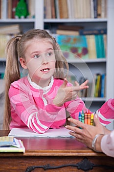 Child chooses the color pencils