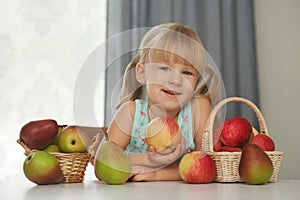 Child choosing a fresh apple to eat