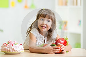 Child choosing healthy vegetables instead of