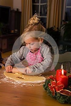 A child at Christmas in Advent when baking cookies