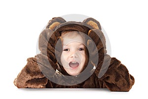Child in a christmas carnival bear costume isolated on white with copy space,  dancing