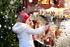 Child at Christmas fair. Xmas market.