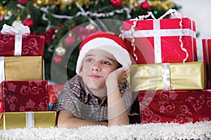 Child in Christmas night dreaming about gifts
