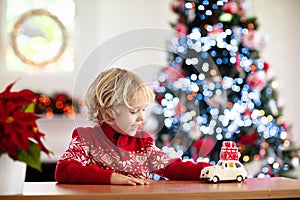 Child with Christmas present. Kid with Xmas gift