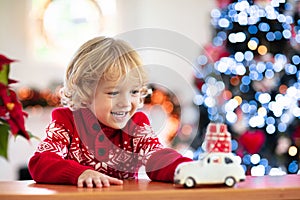 Child with Christmas present. Kid with Xmas gift