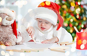 Child before Christmas writes a letter to Santa