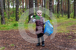 Child clear the forest of garbage. Instilling respect for nature