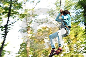 Child in a climbing adventure activity park