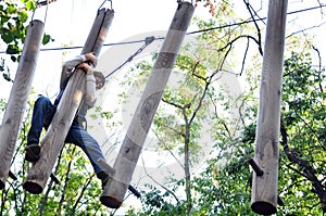 Child in a climbing adventure activity park