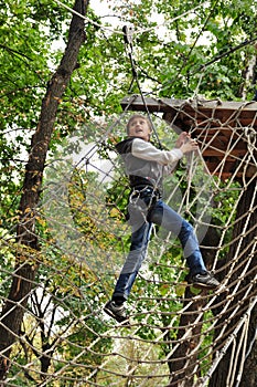 Child in a climbing adventure activity park