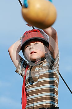 Child climbing in adventure playground