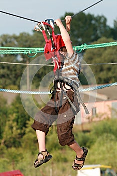 Child climbing in adventure playground