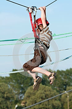 Child climbing in adventure playground