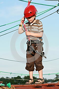 Child climbing in adventure playground