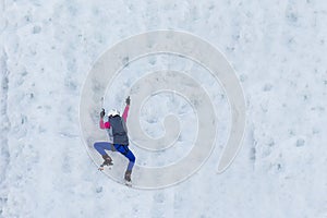 Child climbing frozen waterfall