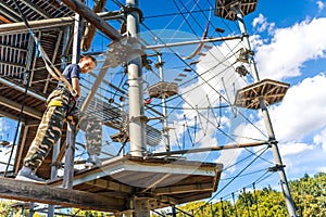 Child climbing in the high ropes course