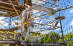 Child climbing in the high ropes course