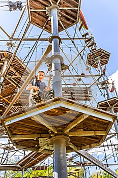 Child climbing in the high ropes course