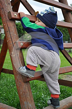 Child climbing step ladder