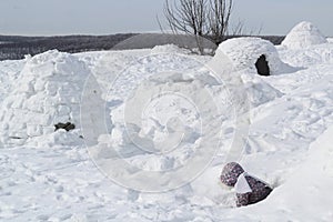 The child climbs out of the snow cave - dwelling Inuit, Igloo